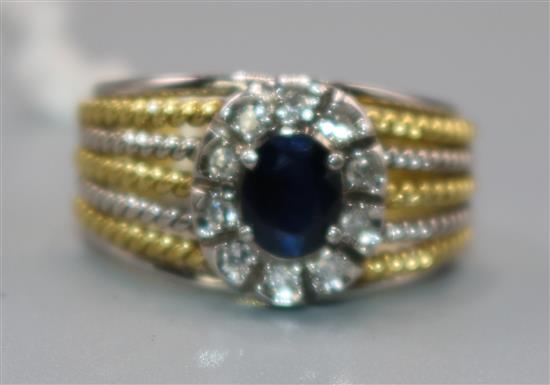 A gold sapphire and diamond ring